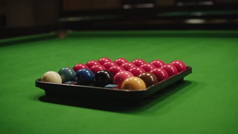 snooker colorful balls close-up on green billiards table for start to play. snooker game. billiard balls with numbers on a pool table. billiards team sport.high quality 4k footage