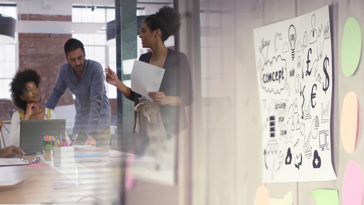 Animation of wall with concept on paper over diverse group of business people