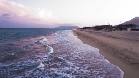 following aerial view about the praia da lagoa coastline at evening, portugal.