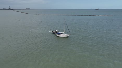 Sailboat-moored-in-Corpus-Christi-Bay-and-the-Water-Po-Po-visiting