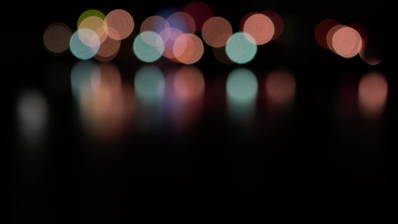the blurred light bokeh on water abstract background, Concept for making blur light background.
