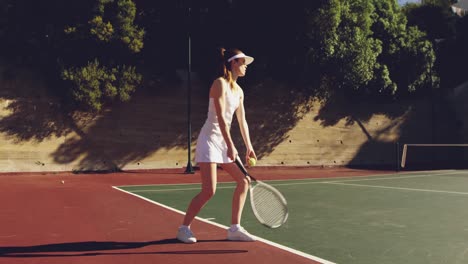 woman and man playing tennis on a sunny day