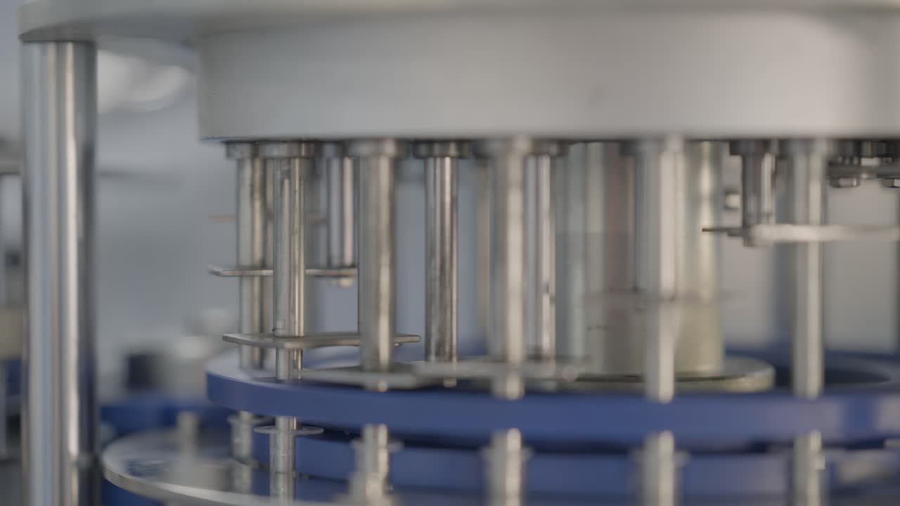 Automated Assembly Machine Manufacturing Medical Syringes In A Production Factory, Close Up