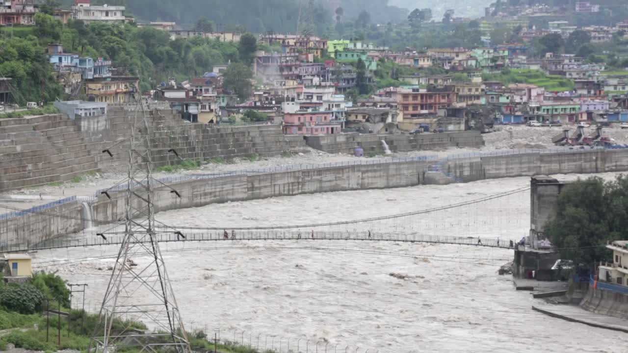 Himalaya mountainous river Ganges flowing through Himalaya villages - cities in Uttarakhand, India.