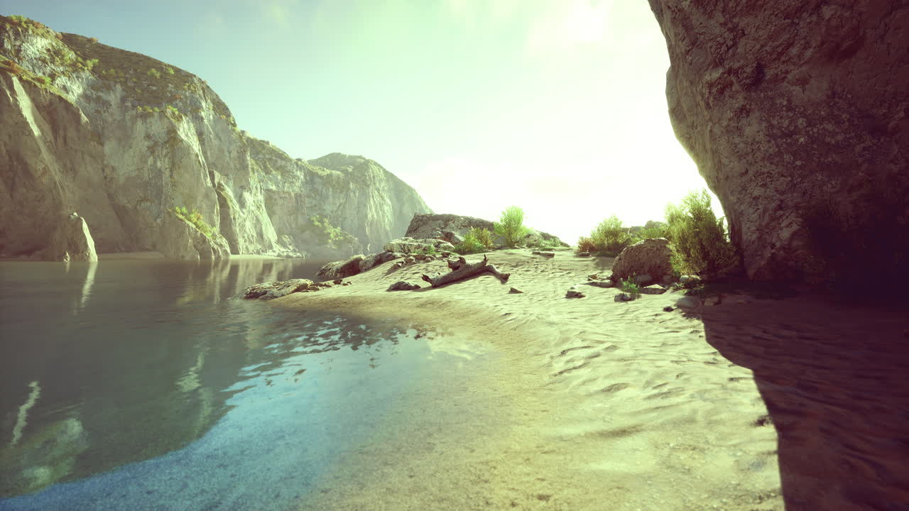 Serene lake surrounded by cliffs and lush vegetation during sunrise