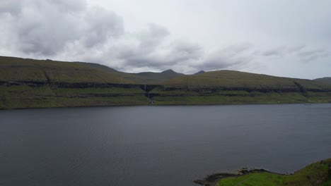 Eysturoy-island-huge-fjord-in-Faroe-Islands,-Fossa-fall-on-background