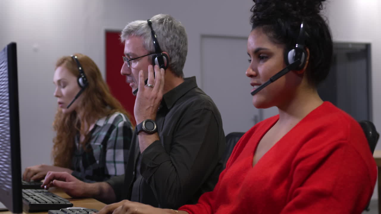 Group of colleagues working with computers in a creative office
