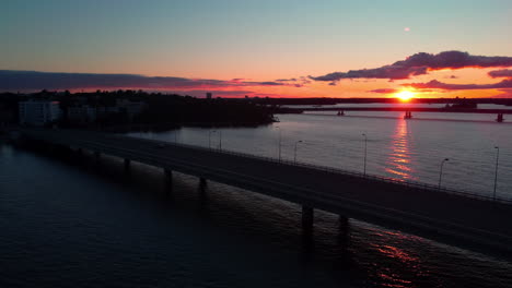 quiet lauttasaarensilta bridge, sunset in helsinki, finland - circling, aerial