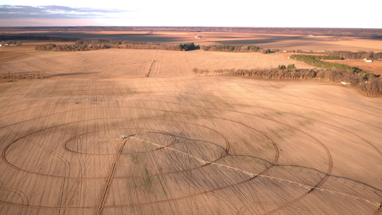 Wide cinematic drone shot of farmland near Peoria Illinois