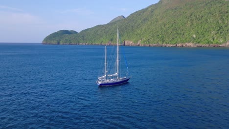 single boat sailing in el valle beach, samana, dominican republic