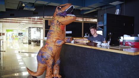 dinosaur costume at a coffee shop