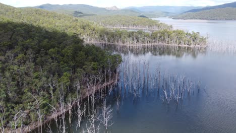 flying over a lake towards three peninsulas