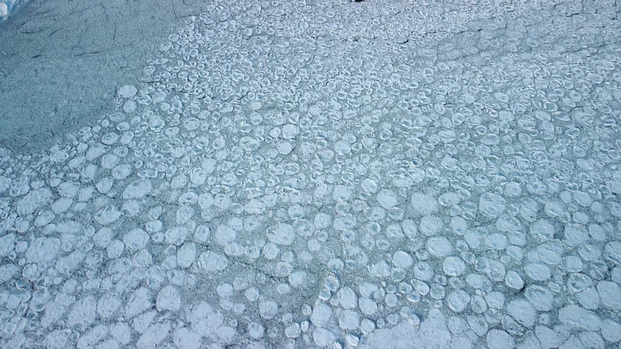Aerial Drone Shot Reveal , Ice break up into water 4K Climate change and Global warming