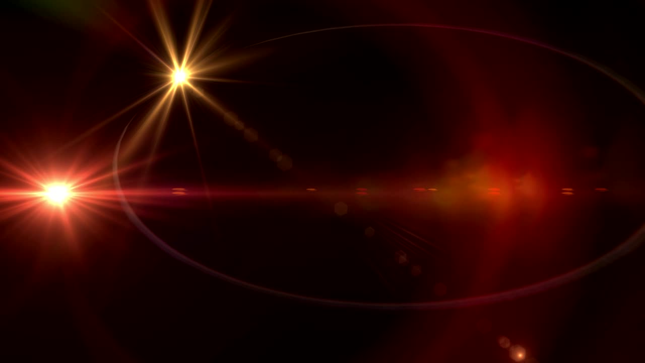 tres puntos de luz contra un fondo negro