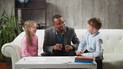 african-american man teaches kids and listens answers
