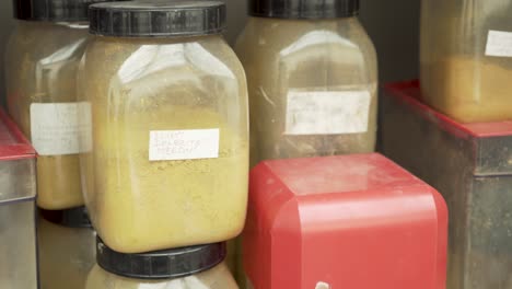 Yellow-pigment-powder-color-in-laboratory,-closeup-shot