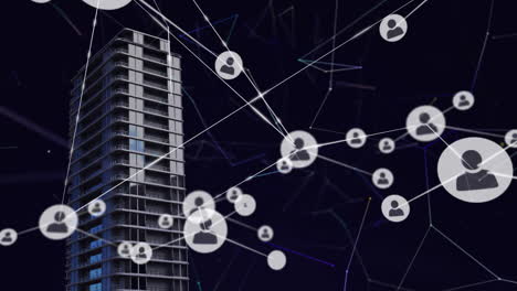 network of profile icons over tall building against black background