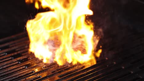 intense flames engulfing food on a grill