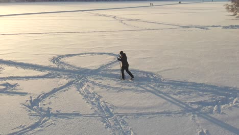 Beginner-skier-on-the-frozen-lake-in-Norway-training-cross-country-skiing