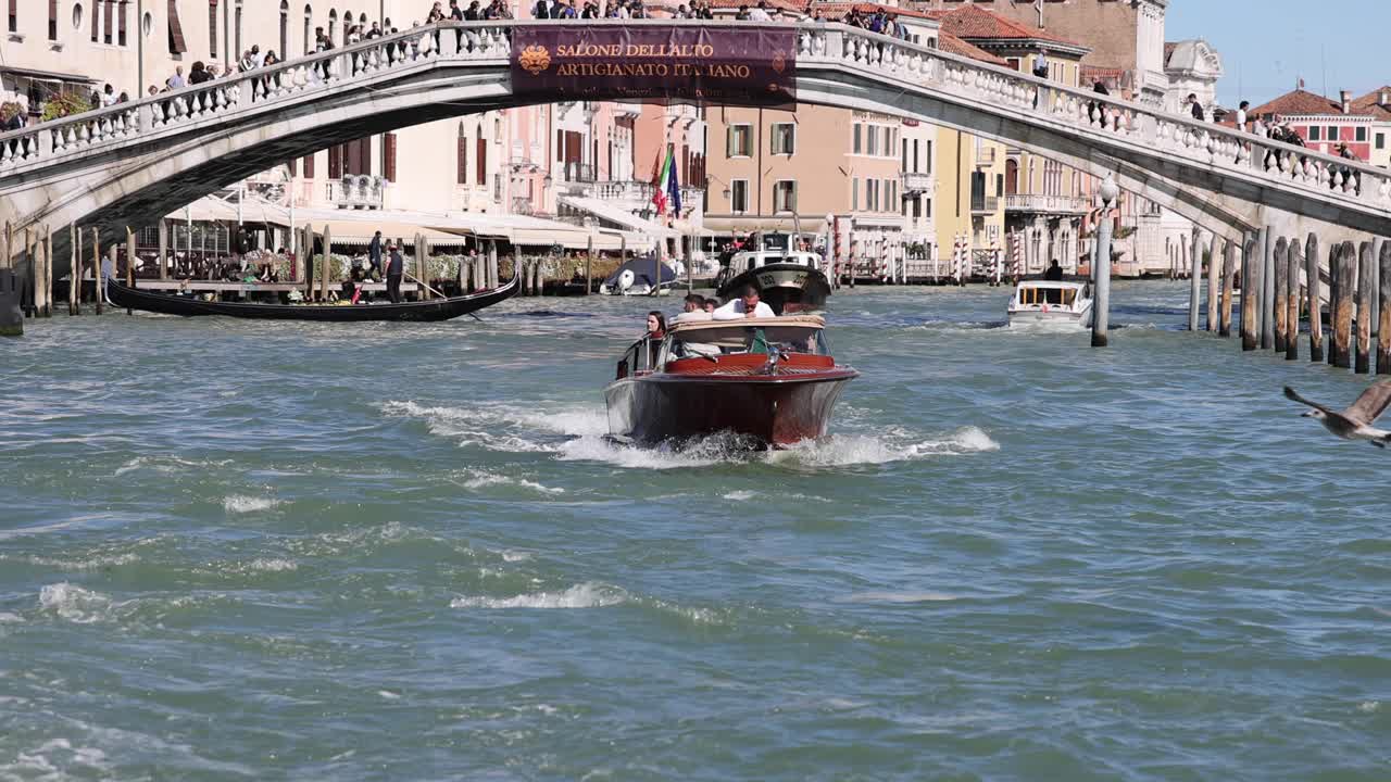 Venice Ponte degli Scalzi: Small Boat Cruising Under Bridge in Slow Motion Venice Italy