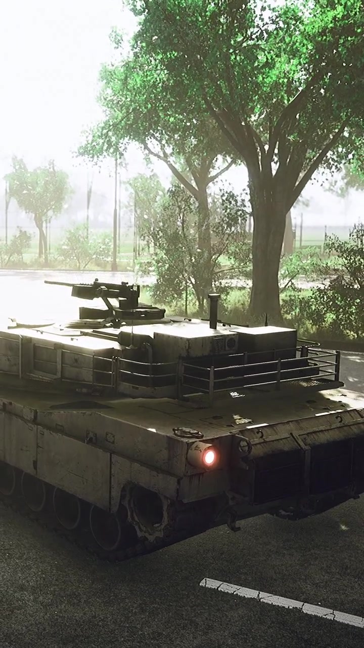 Military tank on a road beside trees in a quiet area during daylight hours