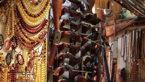 Amber-and-weapons-decorations-in-shop-Krakow-Cloth-Hall,-Poland