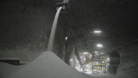 pouring large amounts of salt inside a salt mine