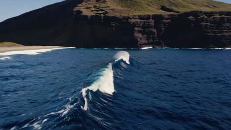 powerful ocean waves breaking near a rocky island