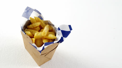 french fried chips in a take away container