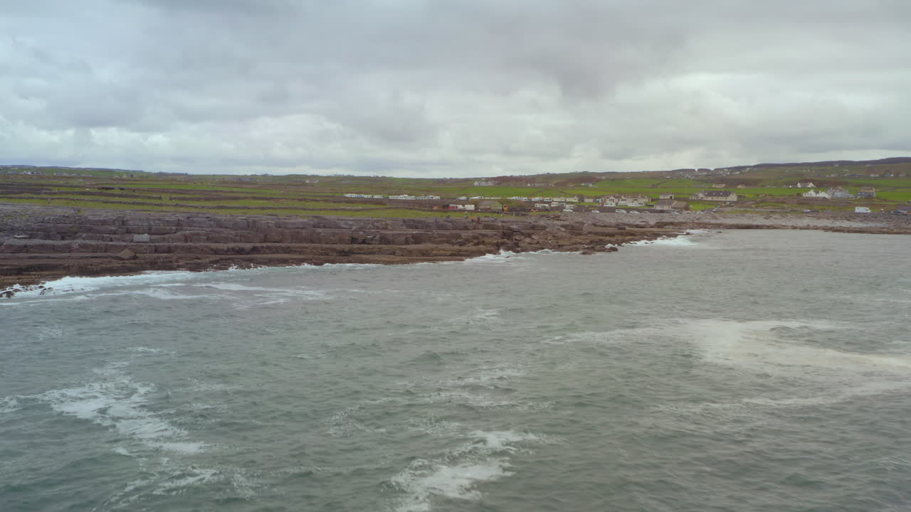 Doolin coast in vast panoramic vista. Aerial dolly. County Clare, Ireland