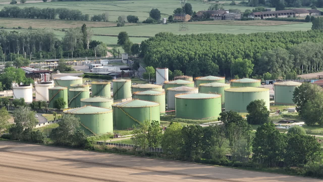 Oil refinery plant at cloudy day.Ecosystem and healthy environment concepts. Lacchiarella, Italy.slow motion at 30 fps
