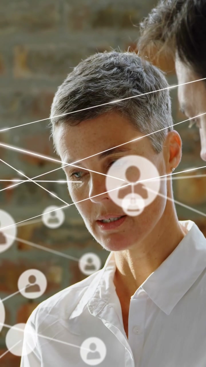 Vertical video: Designer holding car model tapping tablet causing node map aligning to car for auto