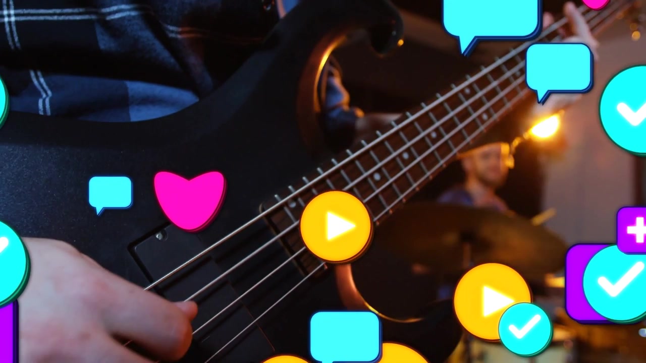 Bassist fingering and plucking strings in studio, showing fan buzz via hearts covering bass and kit