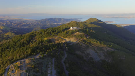 wide aerial establishing shot of astronomy observatory on