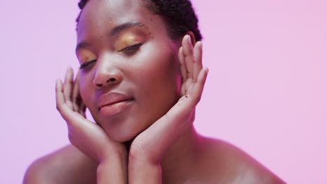 african american woman with short dark hair in blue and pink light, slow motion