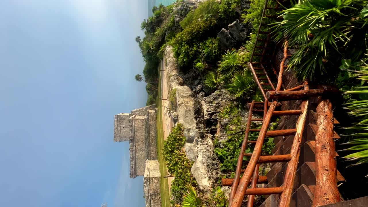 Video shot of archaeological zone with beautiful vegetation in front of the beautiful sunrise in Tulum