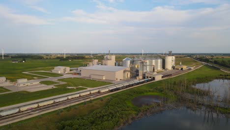 new and modern silos and grain elevator in massive farm in usa, aerial view