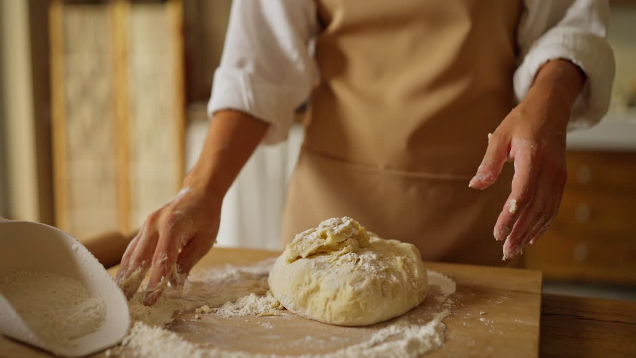 Woman Kneading Dough for Baking