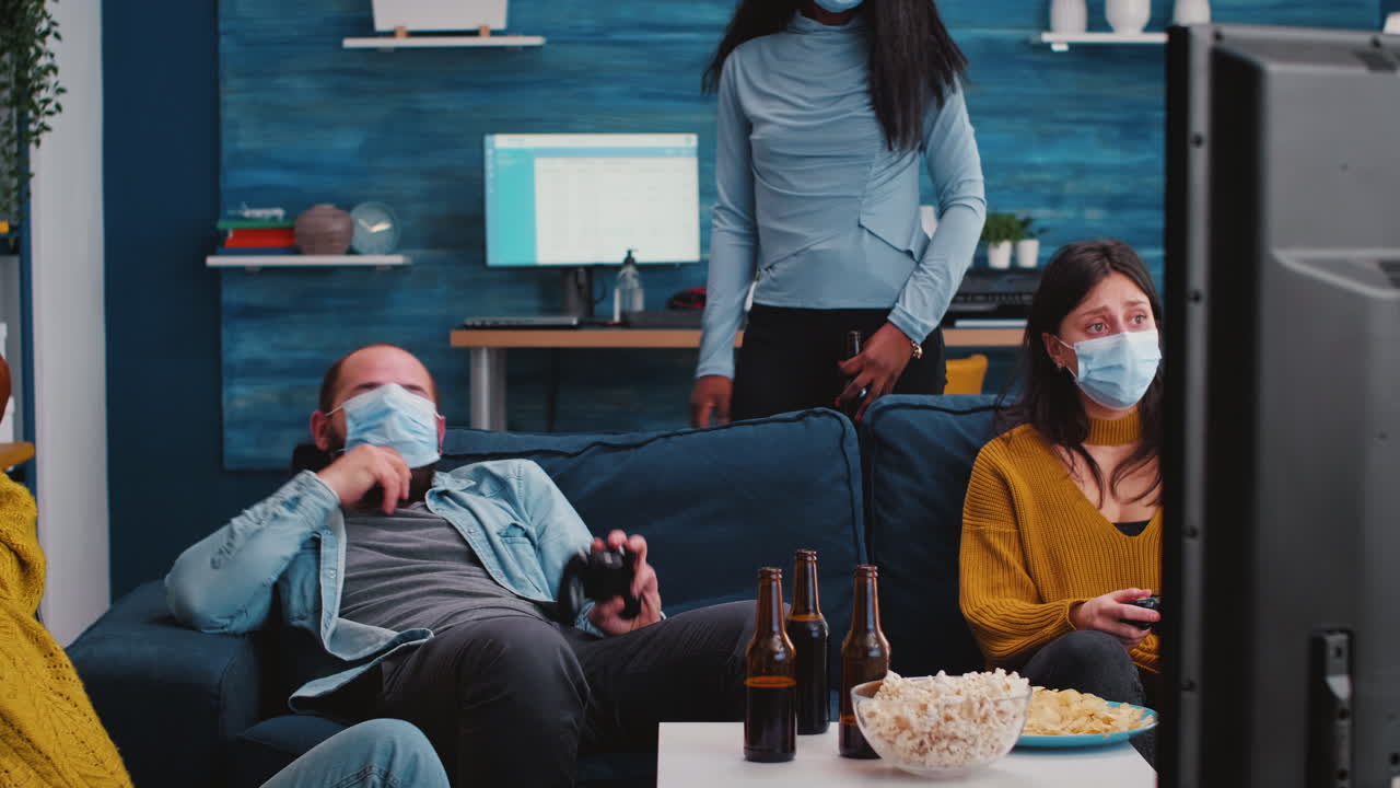 Sad multiethnic group of friends after lose at gaming competiton