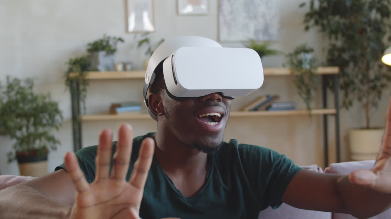 African American Man Using VR Glasses with Excitement