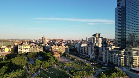 a cinematic horizontal drone push-in shot over williamsburg, brooklyn, gradually revealing the vibrant urban landscape and the iconic skyline in stunning detail.