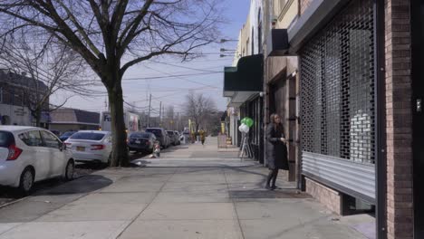 woman entering retail store from the street
