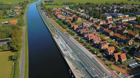 Establishing-traditional-Dutch-canal-with-street-and-cute-houses-in-a-row