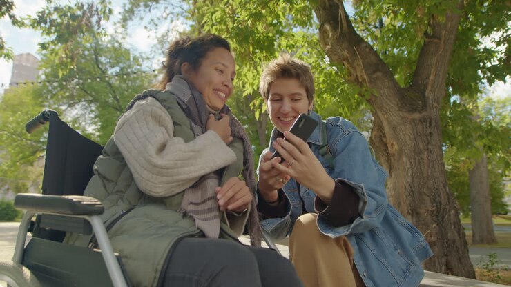 Two friends taking a selfie in the park