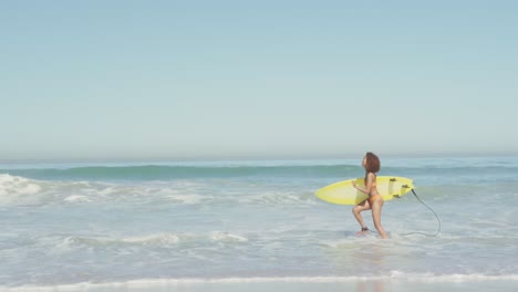 african american woman ready to go surf