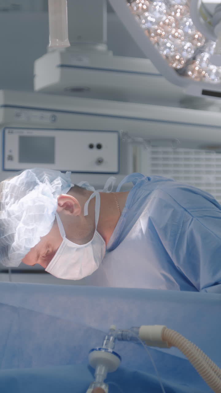Male surgeon operates patient with colleagues 4k 2025 08 04 22 49 15 utc.mov | anesthesiology, clinic, emergency, equipment