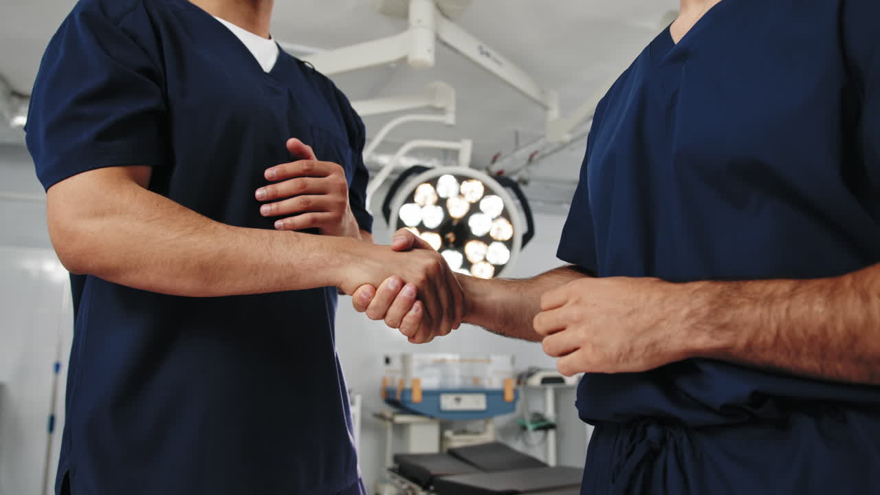 Doctors handshake in operating room