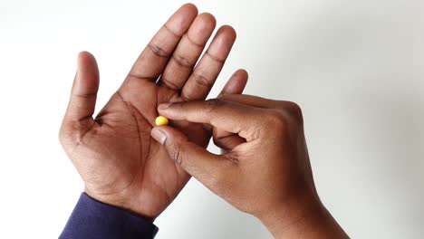 top view of men taking medical pills