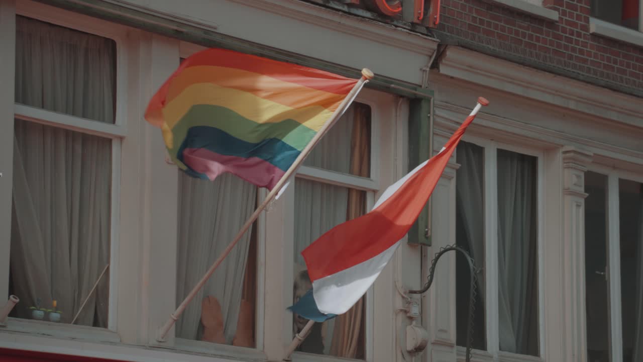Images of Pride Flags Displayed in Windows