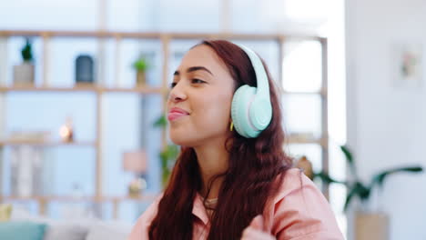 Dance,-music-and-woman-with-headphones-on-a-sofa